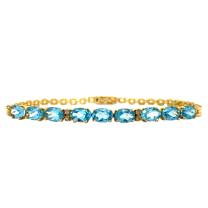 Gold bracelet with topaz and diamond 18 krt