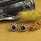 vintage Gouden entourage oorstekers met granaat 14 krt