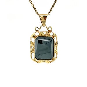 Gold pendant with haematite 14 krt