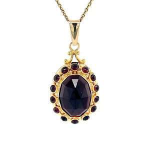 Gold pendant with garnet 14 krt