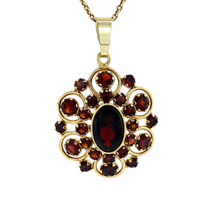 Gold entourage pendant with garnet 14 krt