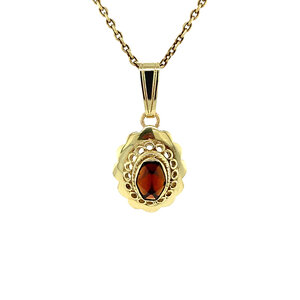 Gold pendant with garnet 14 krt