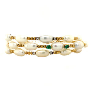 Gold bracelet with pearl, emerald and diamond 18 krt