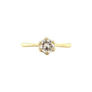 Gold solitaire ring with diamonds 14 krt