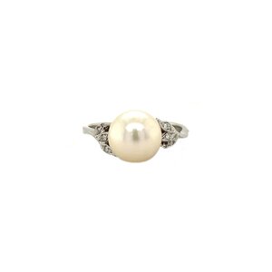 Golden ring with diamond and pearl 18 kt