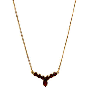 Gold curb necklace with garnet pendant 14 krt