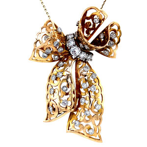 Gold bow pendant with diamond 14 kt/950