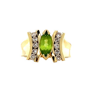 Gold ring with peridote and diamonds 14 krt