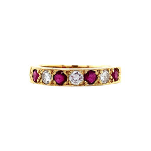 Gold row ring with ruby and diamonds 18 krt