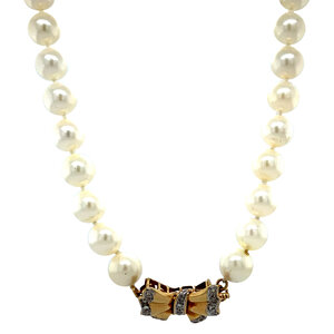 Pearl necklace with gold bow clasp 14 krt