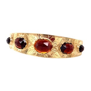 Gold bangle with garnet 14 krt