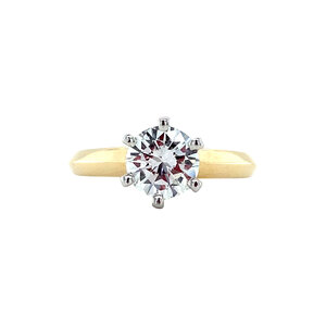 Gold solitaire ring with diamonds 14 krt