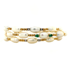 Gold bracelet with pearl, emerald, and diamond 18 carat