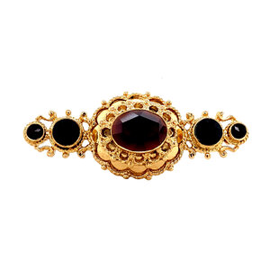 Gold brooch with garnet 14 krt