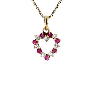 Gold heart pendant with ruby and diamonds 14 krt