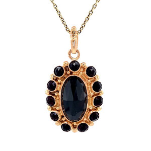 Gold pendant with garnet 14 krt