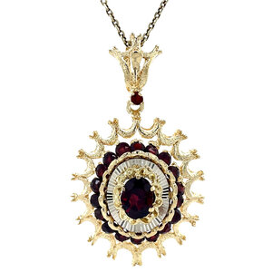 Golden pendant with garnet 14 kt