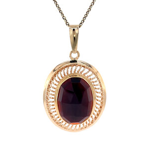 Gold pendant with garnet 14 kt