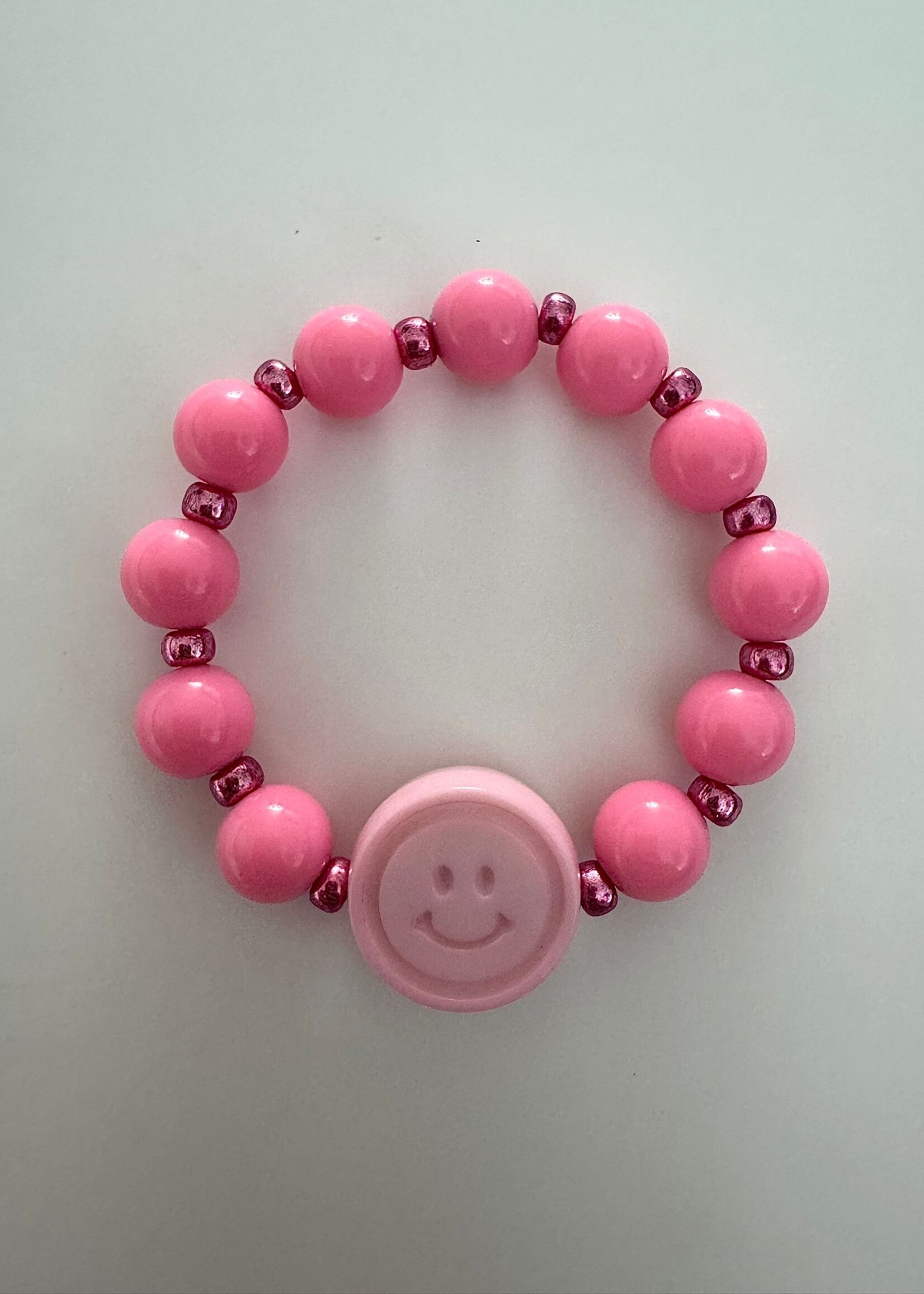 Armbandje smiley roze  - By melo