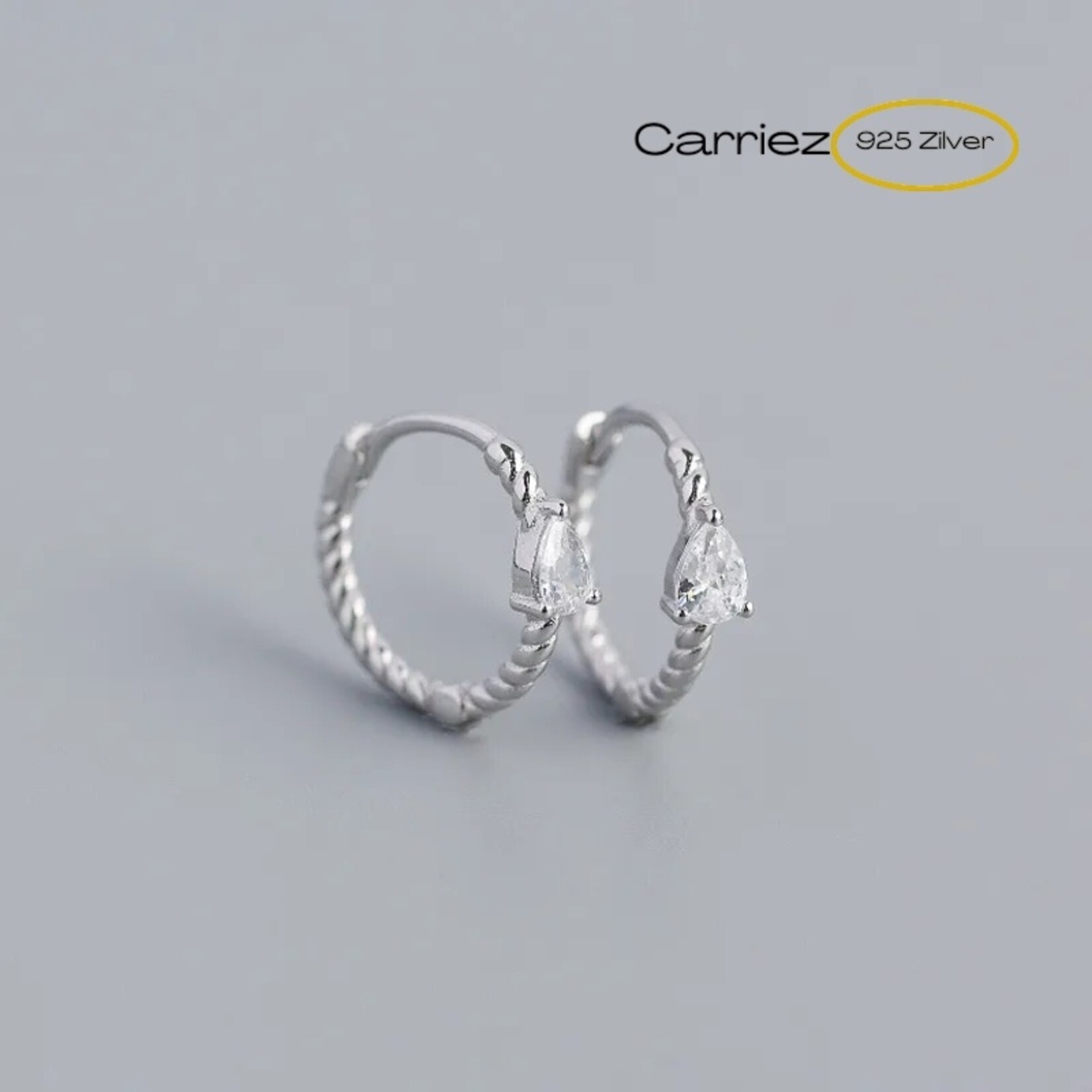 Carriez 925 zilveren twist oorringen met witte cz druppel