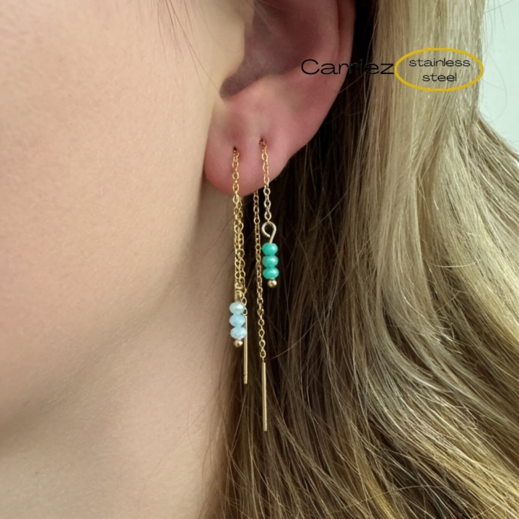 Carriez Gouden doorhaal oorbellen met 3 blauwe steentjes stainless steel