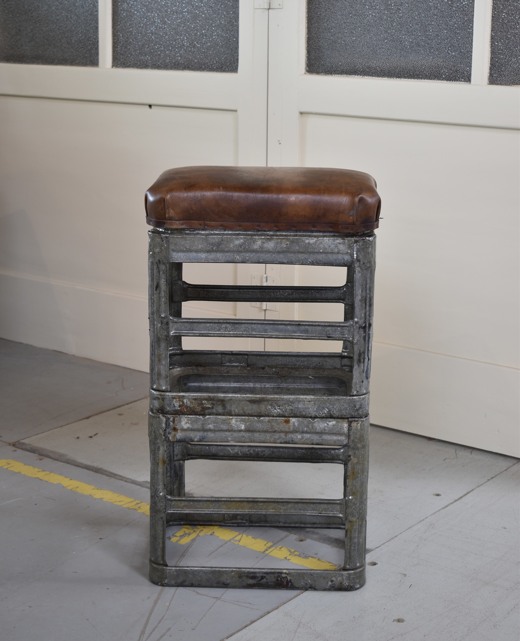 Metal stool with leather cushion high model