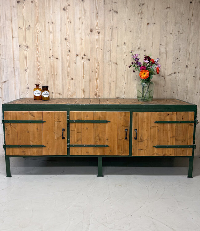 Vintage steel workbench with wooden doors