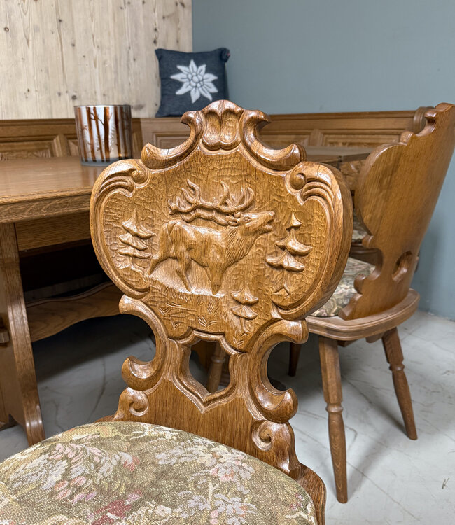 Austrian Stube dining area with hunting carvings