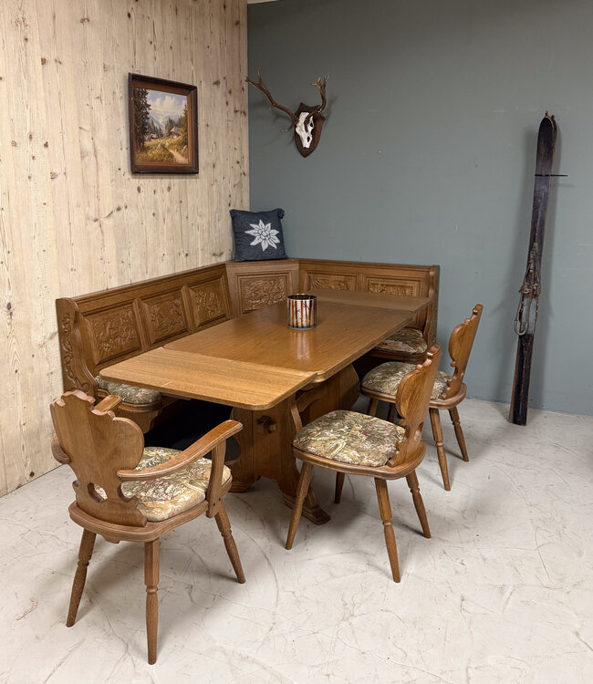 Austrian Stube dining area with hunting carvings