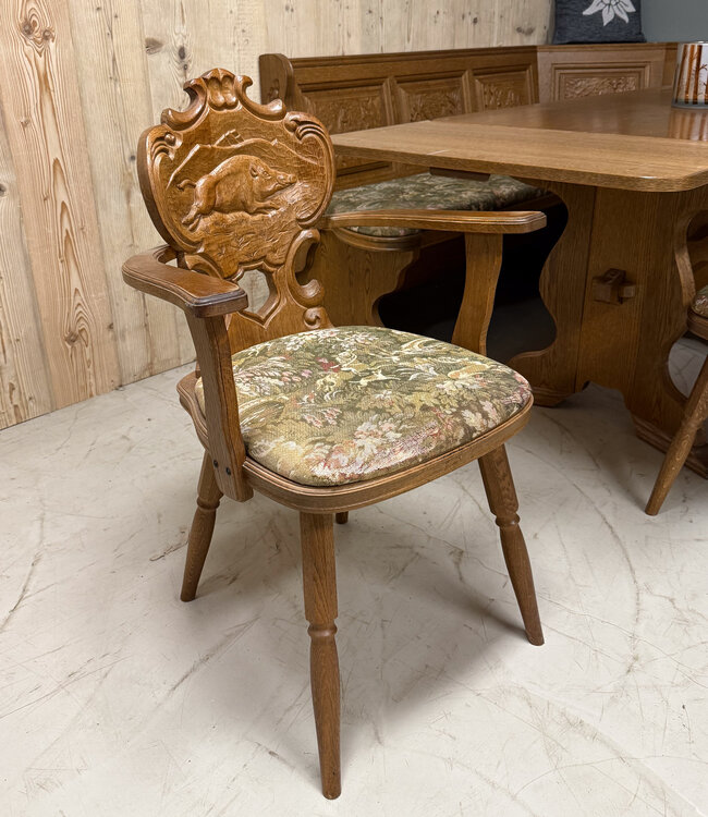 Austrian Stube dining area with hunting carvings