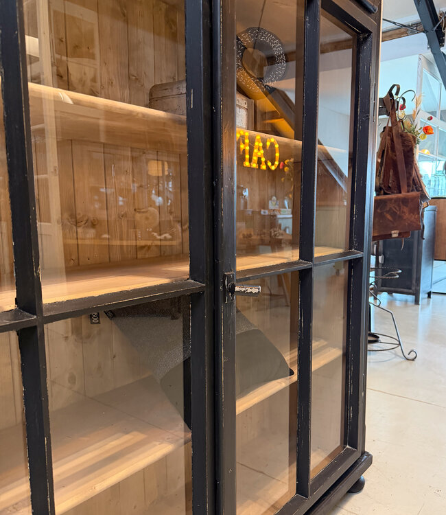 Vintage black display cabinet with old glass