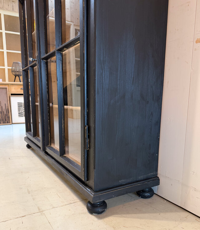 Vintage black display cabinet with old glass