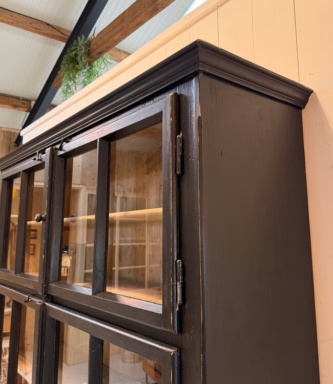 Vintage black display cabinet with old glass