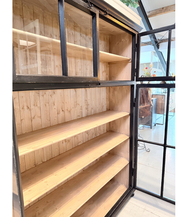 Vintage black display cabinet with old glass