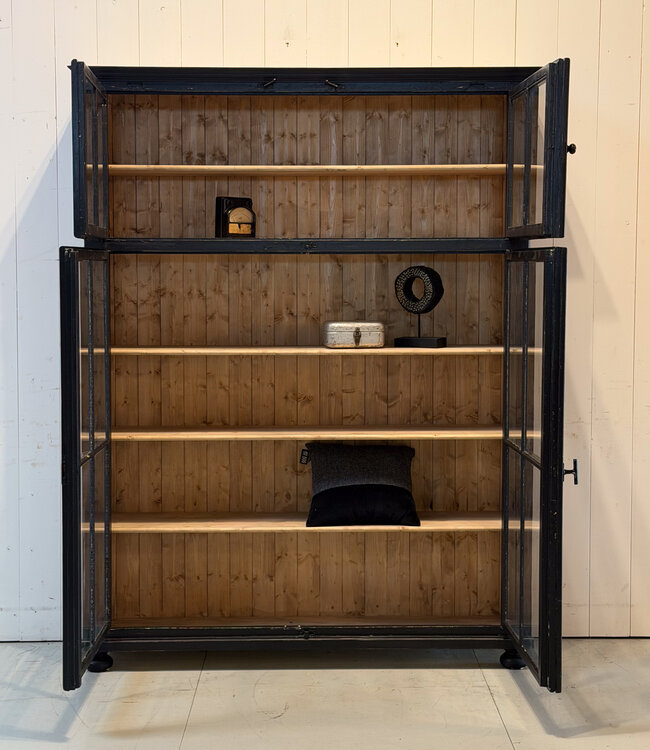 Vintage black display cabinet with old glass