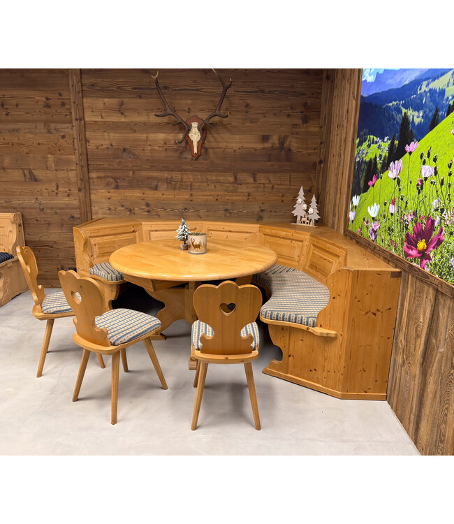Stube circular seating | Austrian dining area | Round sofa + table and chairs