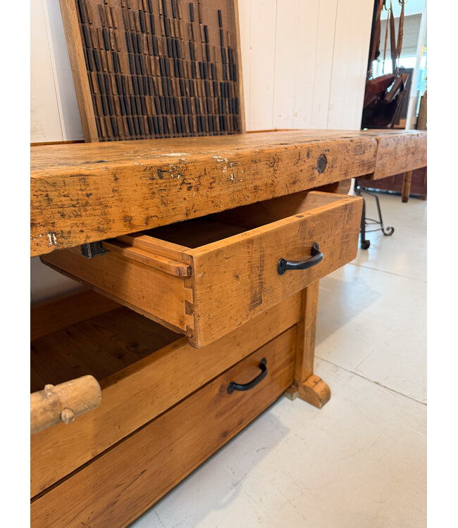 Vintage wooden workbench with drawers