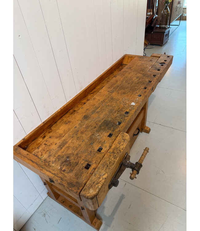 Vintage wooden workbench with drawers