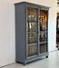 Grey vintage wooden buffet cabinet with old glass