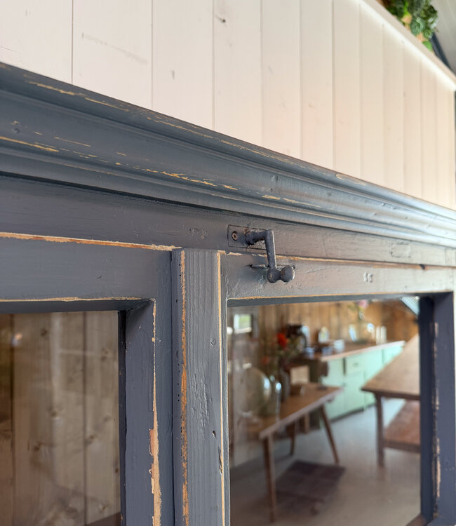 Grey vintage wooden buffet cabinet with old glass