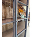Grey vintage wooden buffet cabinet with old glass