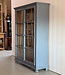 Grey vintage wooden buffet cabinet with old glass