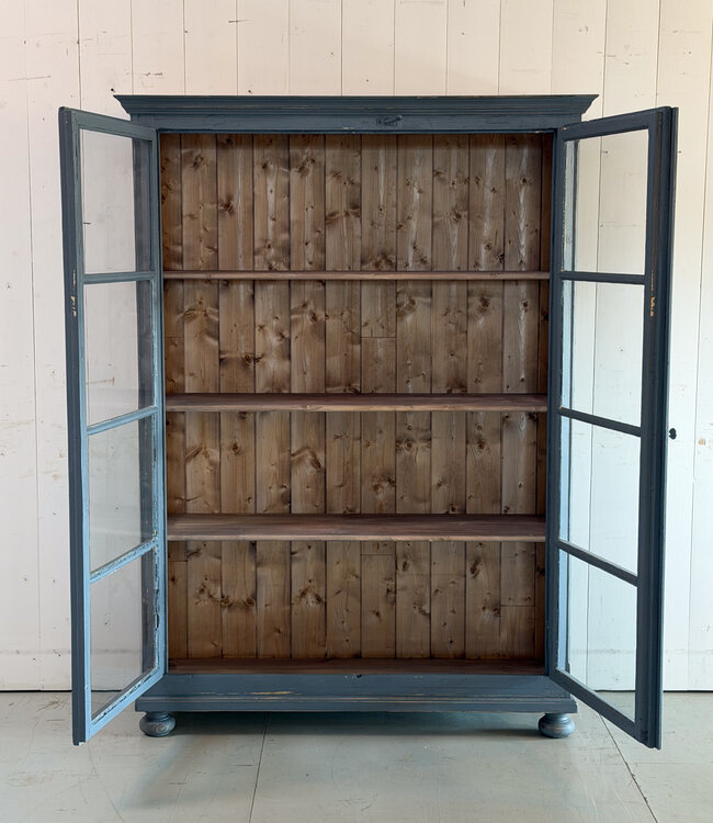 Grey vintage wooden buffet cabinet with old glass