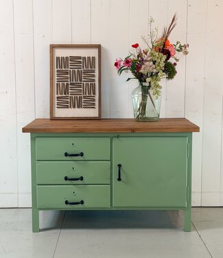 Green industrial workbench with door and drawers
