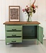 Green industrial workbench with door and drawers