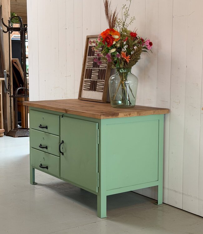 Green industrial workbench with door and drawers