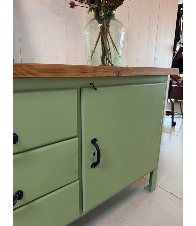 Green industrial workbench with door and drawers