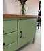 Green industrial workbench with door and drawers