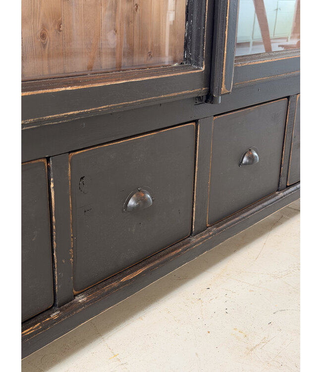 Black vintage wooden display cabinet with old glass