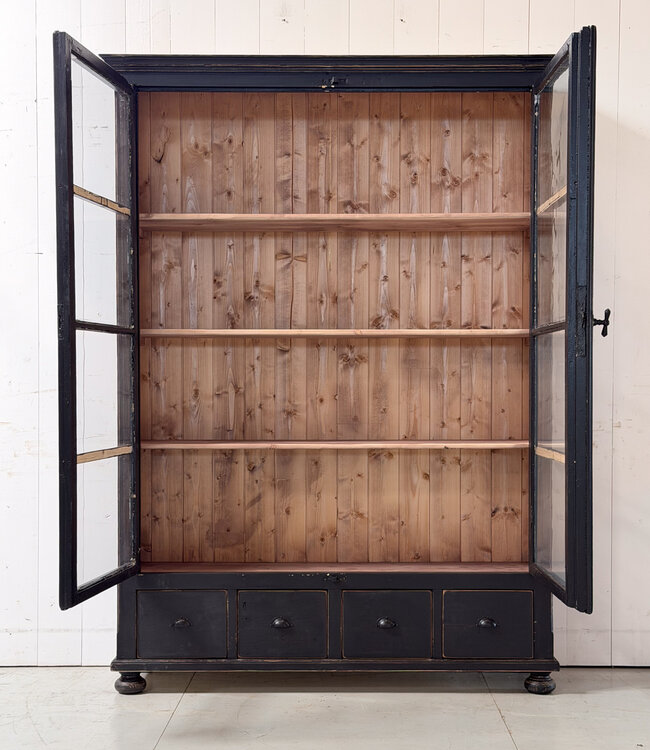 Black vintage wooden display cabinet with old glass